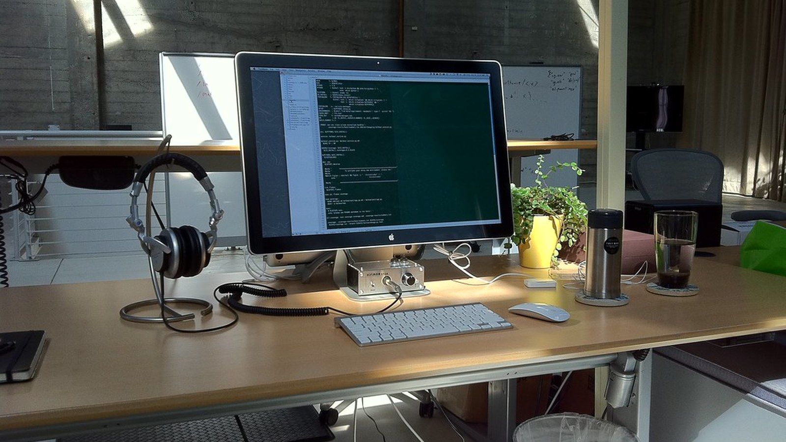 How to Organize a Workspace Around a Large Monitor Without Blocking Everything Else